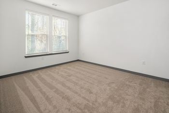 Room with a carpeted floor